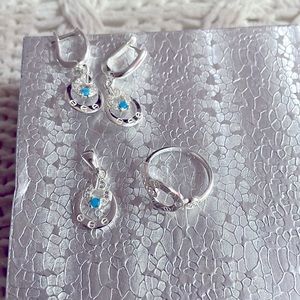 Set earrings, ring and pendant